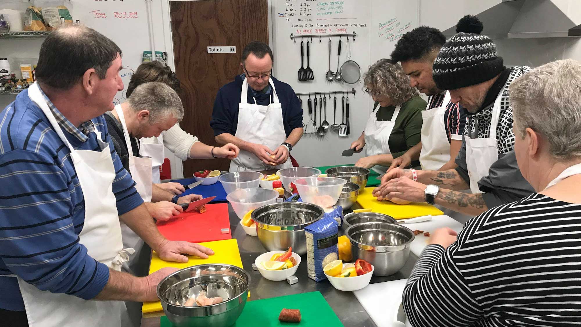 group of people cooking together