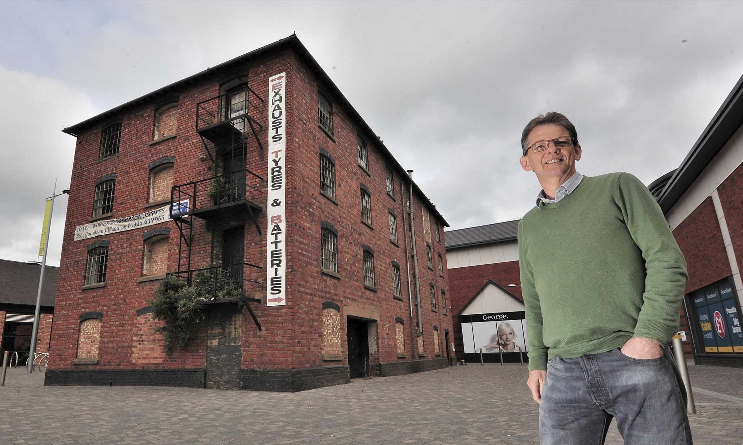 Man stood outside old granary building
